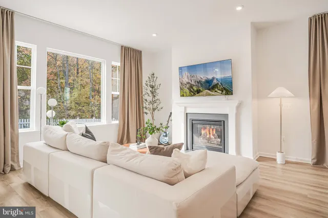 a view of a hallway with paintings on the wall