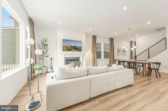 a spacious bedroom with a bed and a large window