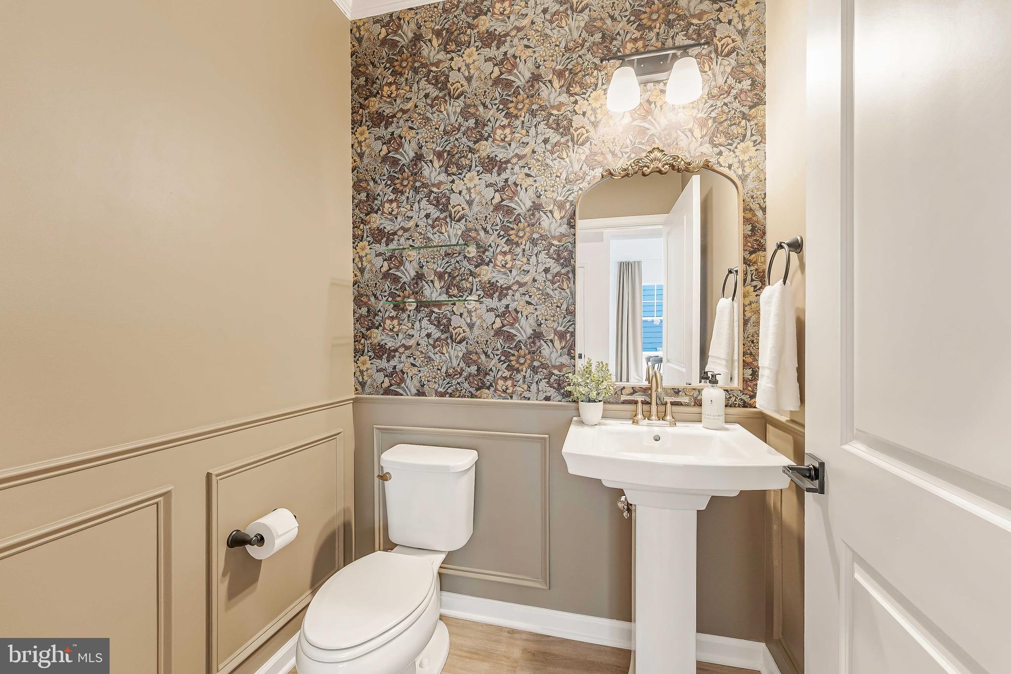 18260 Moss Garden Road Dumfries, VA 22026 - Photo 18 of 97 a bathroom with a sink mirror toilet and a shower