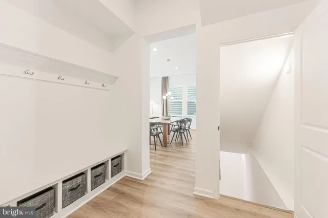 a bedroom with a bed and a potted plant