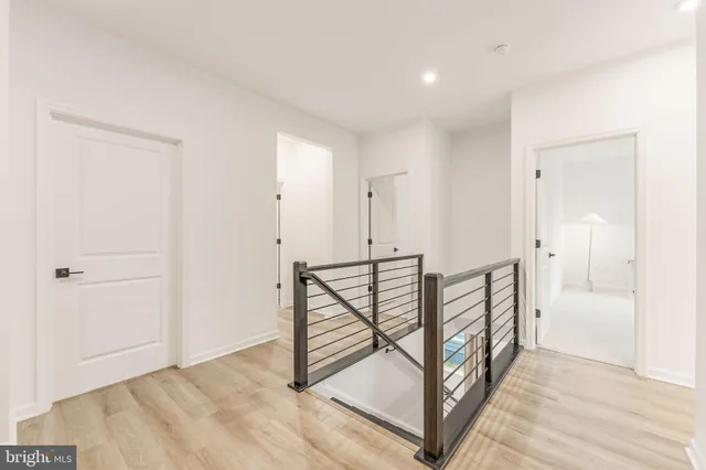 a bedroom with a large bed and a large window