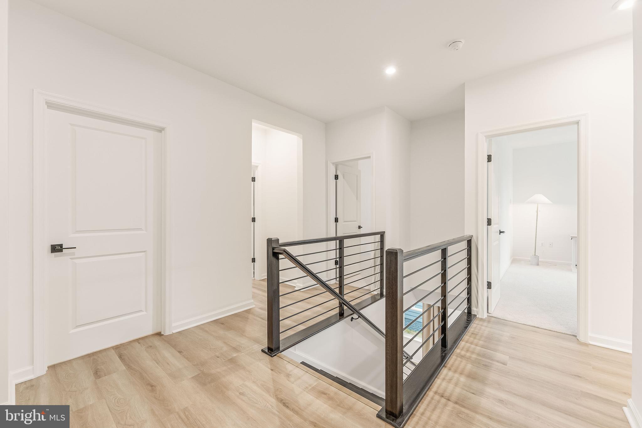 18260 Moss Garden Road Dumfries, VA 22026 - Photo 21 of 97 a view of a hallway with paintings on the wall