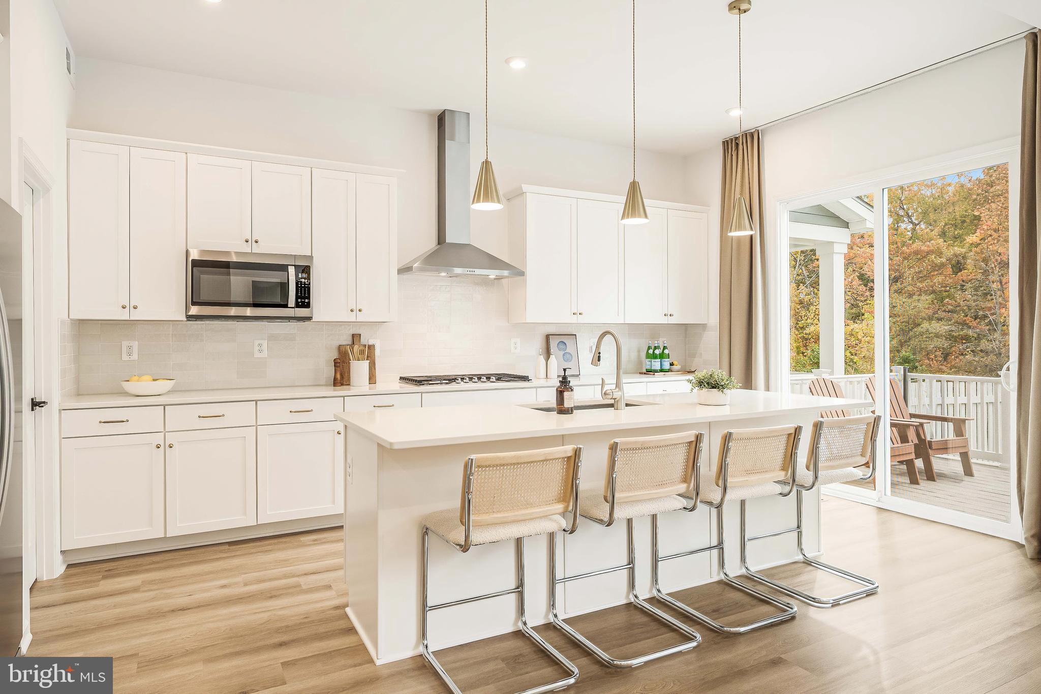 18260 Moss Garden Road Dumfries, VA 22026 - Photo 3 of 97 a kitchen with stainless steel appliances granite countertop a stove a sink dishwasher and a refrigerator with wooden floor