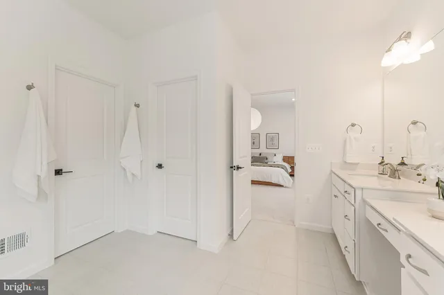 a dining room with furniture and a chandelier