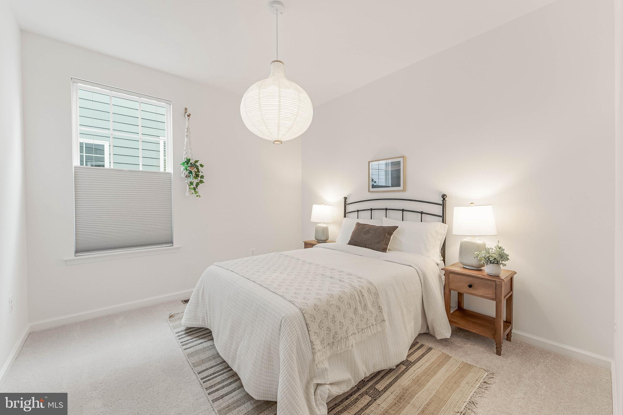 18260 Moss Garden Road Dumfries, VA 22026 - Photo 36 of 97 a bedroom with a bed and a window