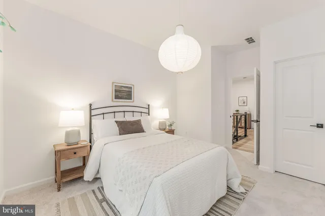 a bedroom with a bed and a view of bathroom