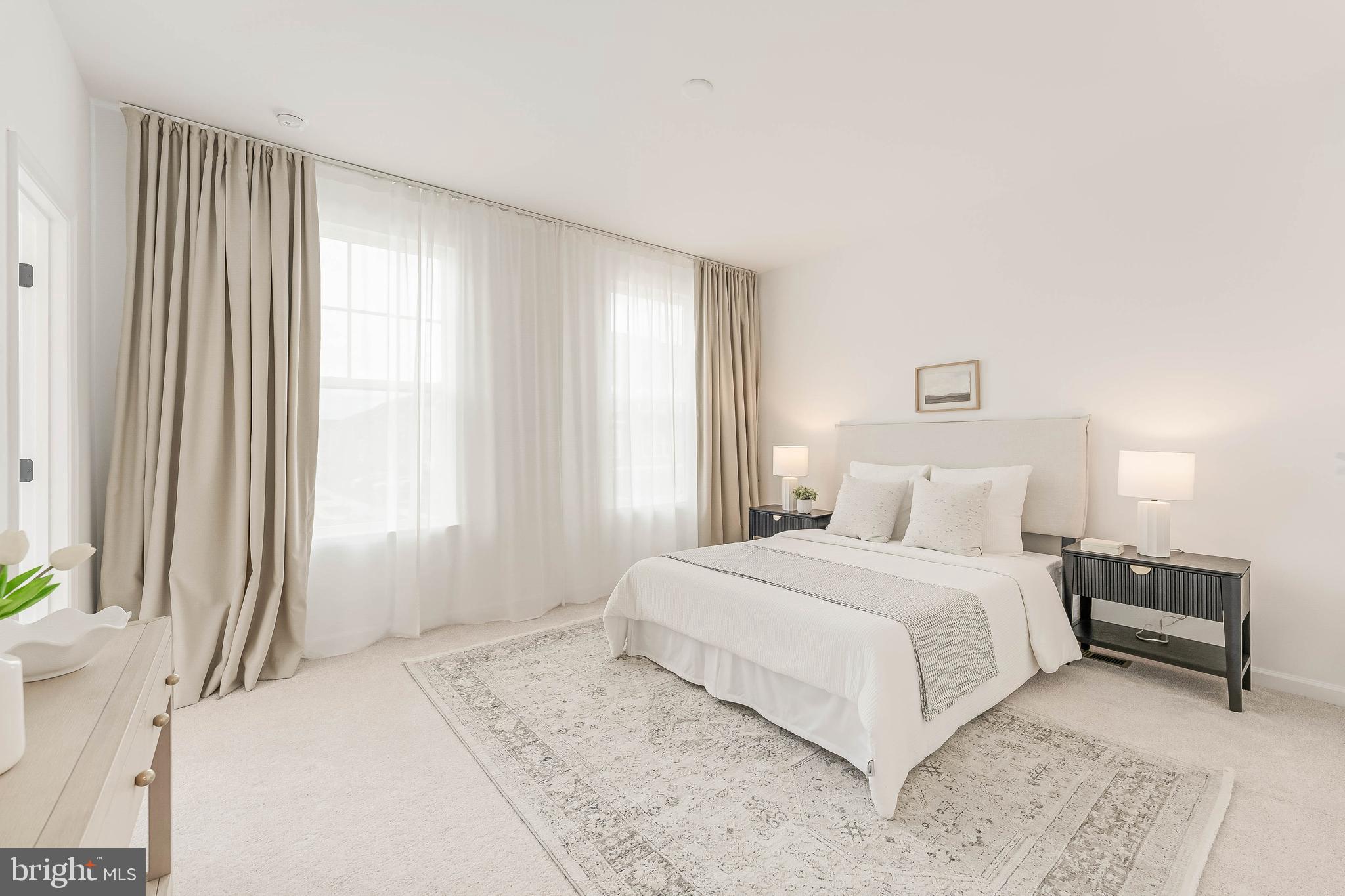 18260 Moss Garden Road Dumfries, VA 22026 - Photo 39 of 97 a bedroom with a large bed and a large window