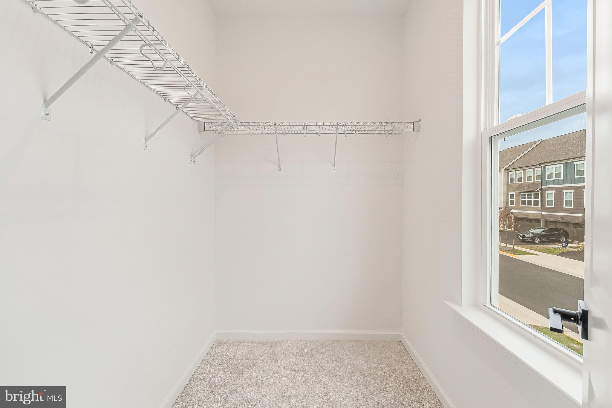 18260 Moss Garden Road Dumfries, VA 22026 - Photo 44 of 97 a view of a room with racks on the wall