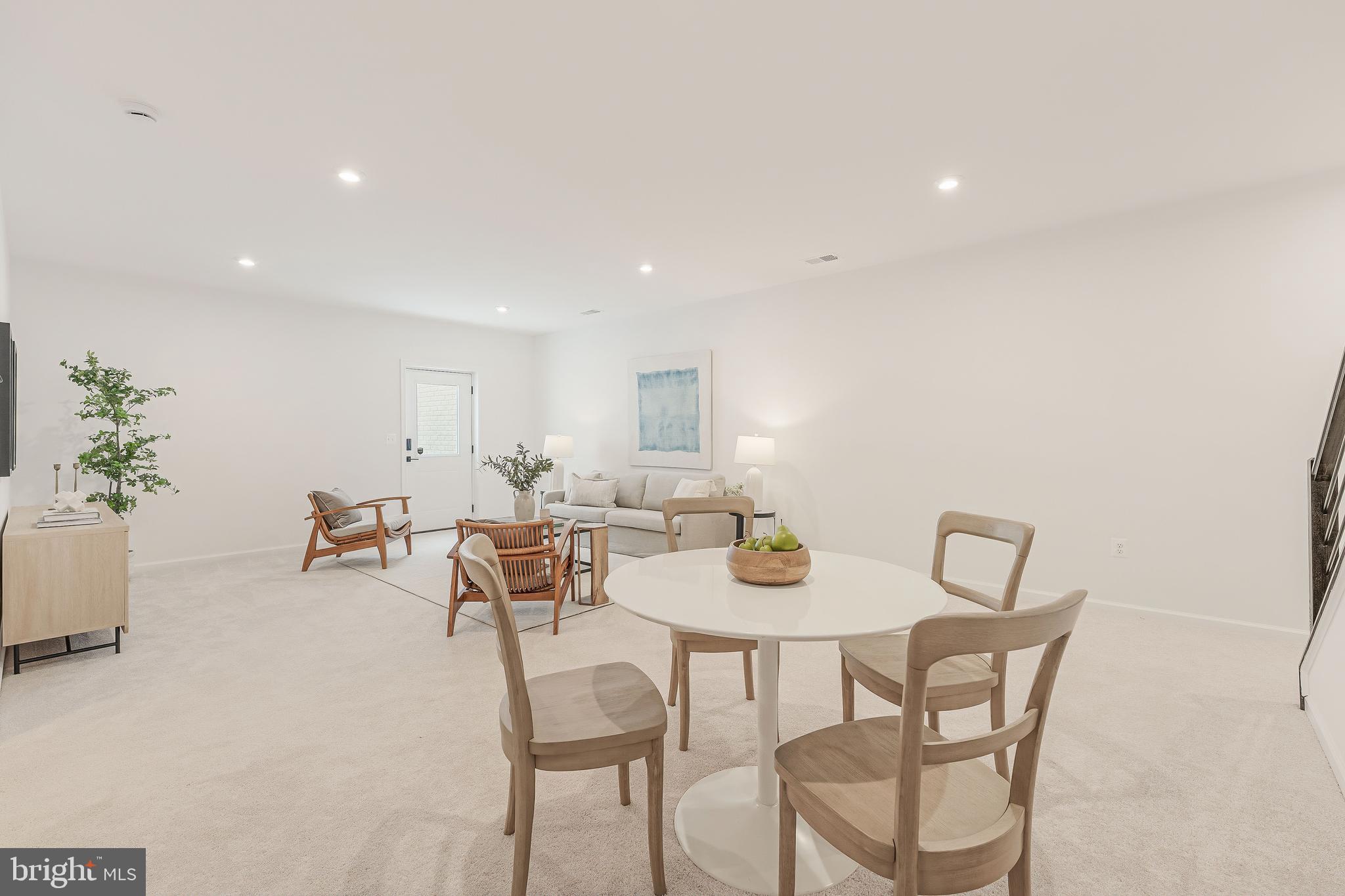 18260 Moss Garden Road Dumfries, VA 22026 - Photo 53 of 97 a view of a dining room with furniture and potted plant