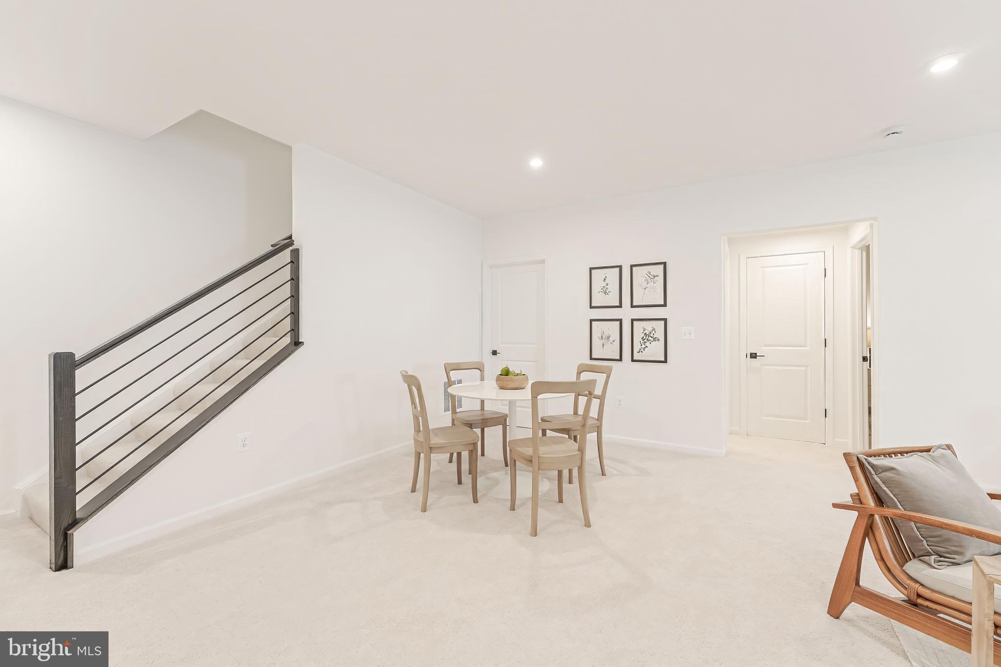 18260 Moss Garden Road Dumfries, VA 22026 - Photo 56 of 97 a dining room with furniture and a chandelier