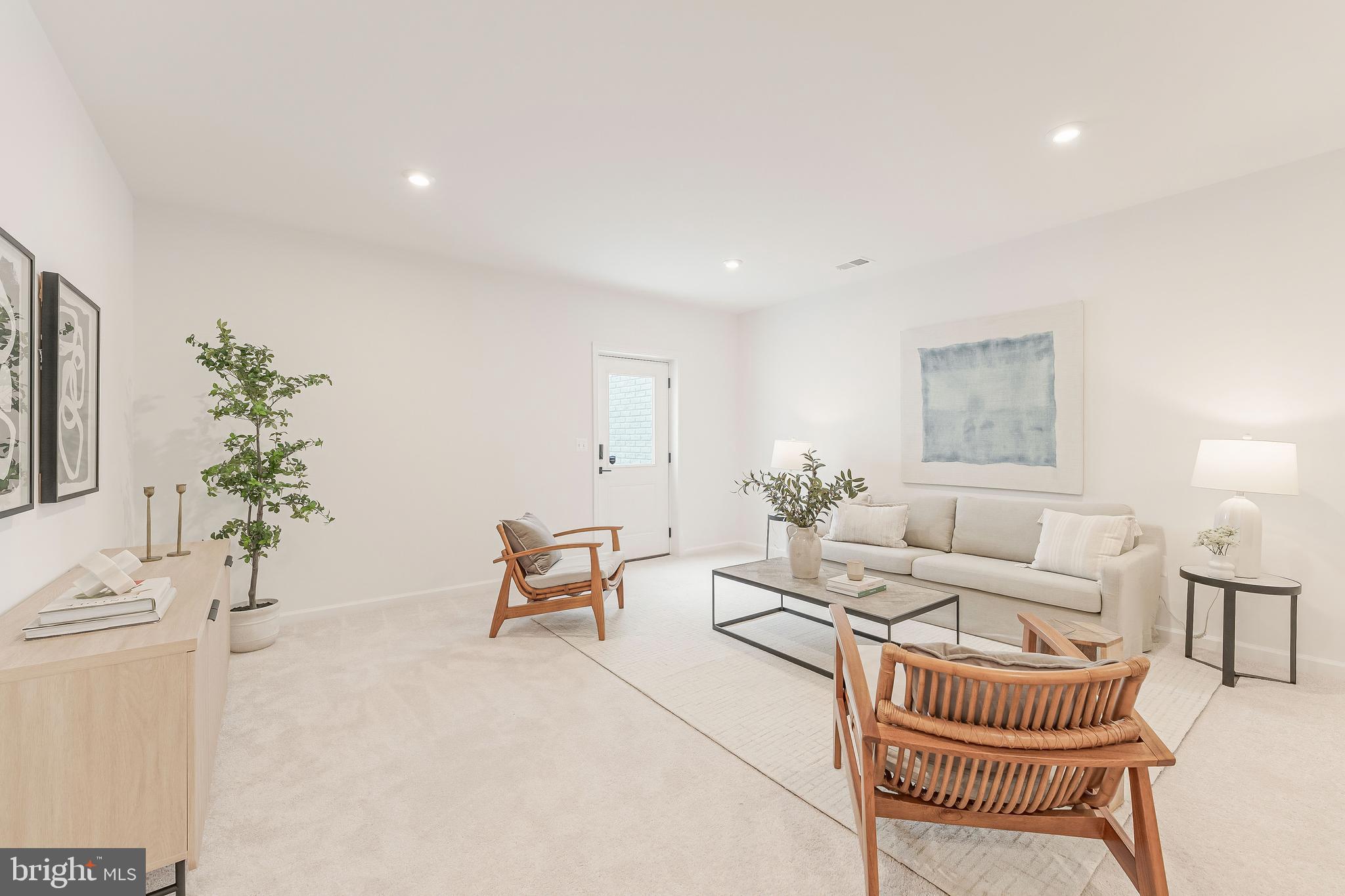 18260 Moss Garden Road Dumfries, VA 22026 - Photo 57 of 97 a living room with furniture and a potted plant