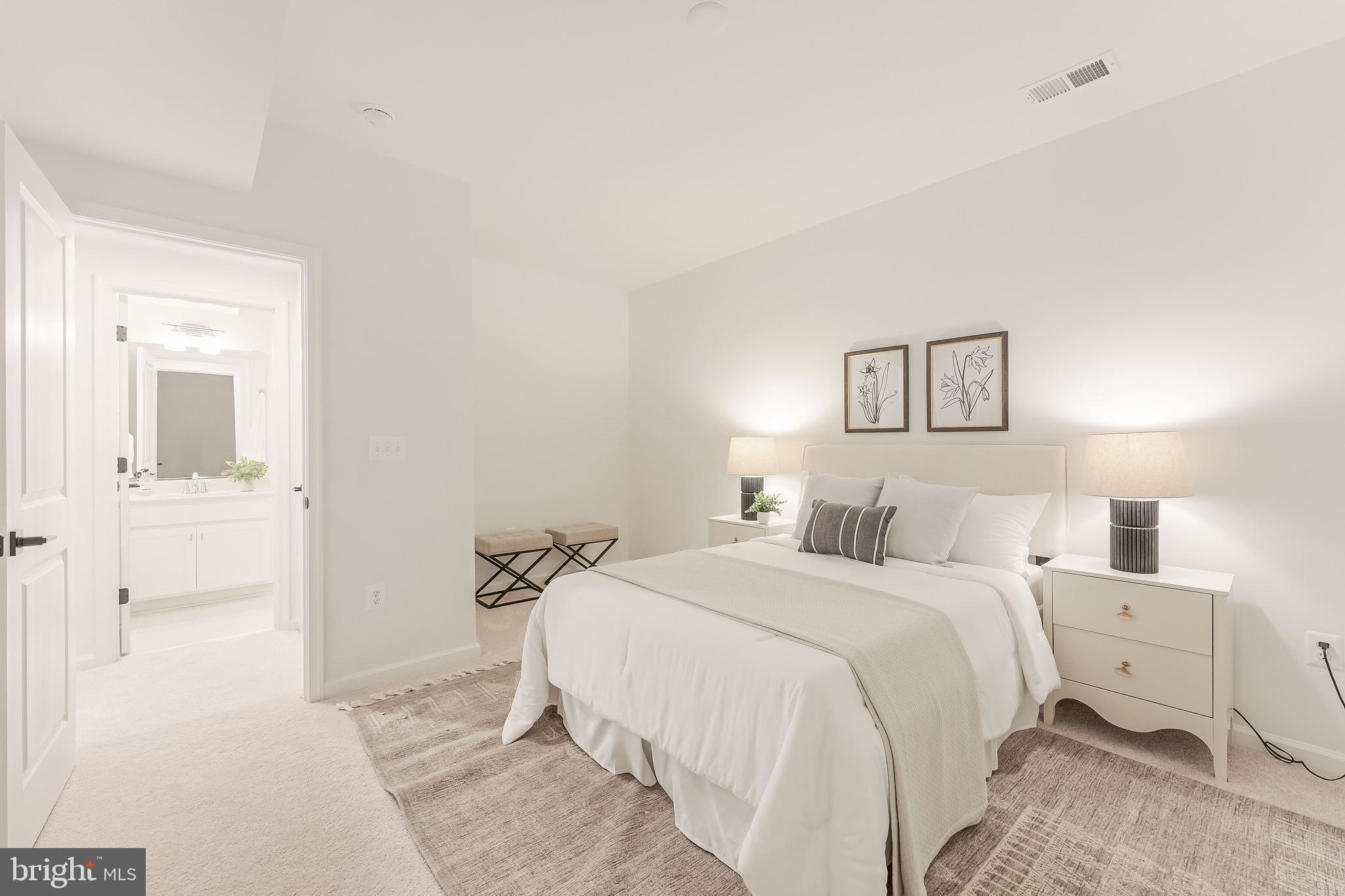 18260 Moss Garden Road Dumfries, VA 22026 - Photo 63 of 97 a bedroom with a bed and a view of bathroom