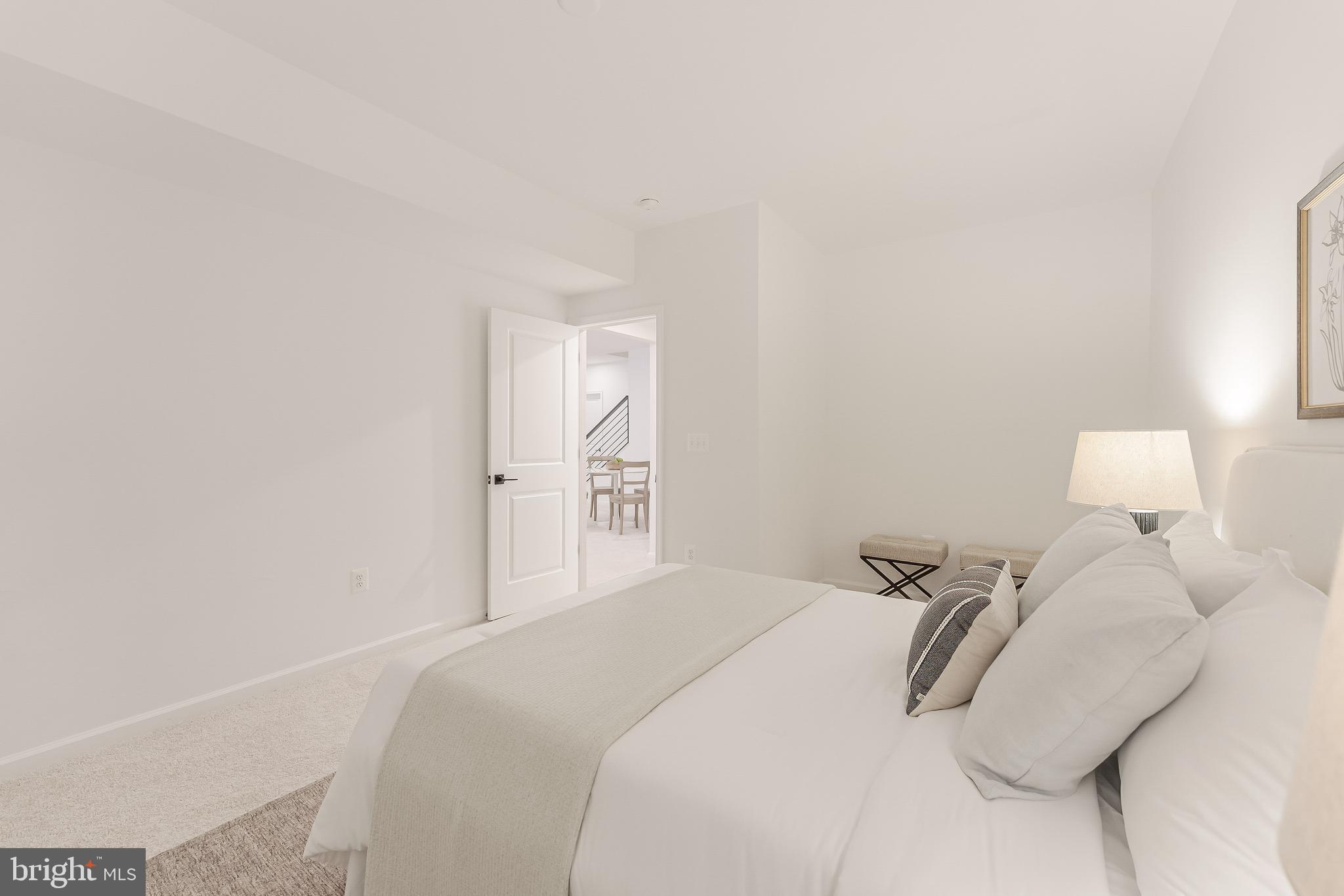 18260 Moss Garden Road Dumfries, VA 22026 - Photo 65 of 97 a bedroom with a bed and a night stand