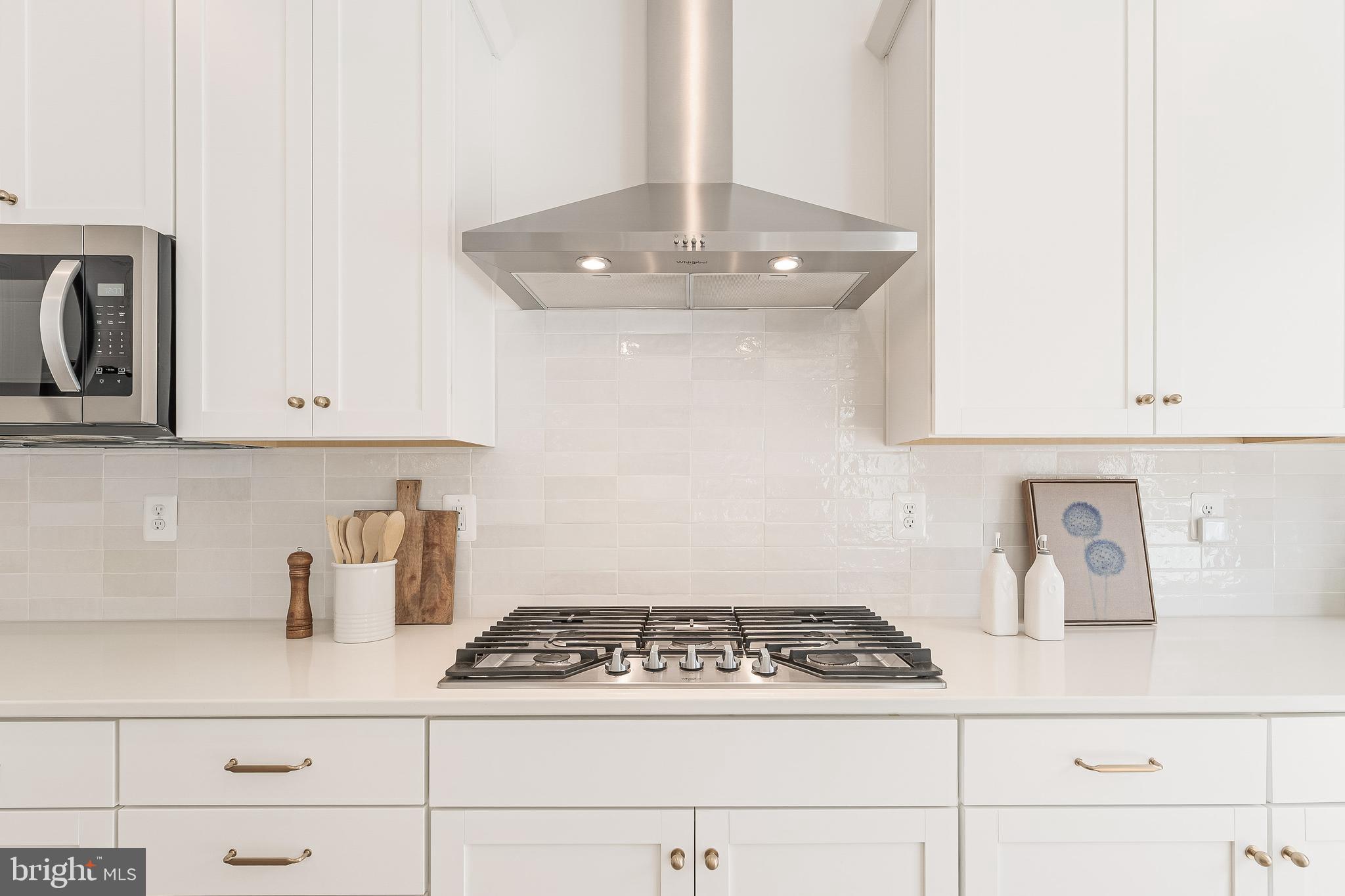 18260 Moss Garden Road Dumfries, VA 22026 - Photo 8 of 97 a white stove top oven sitting inside of a kitchen