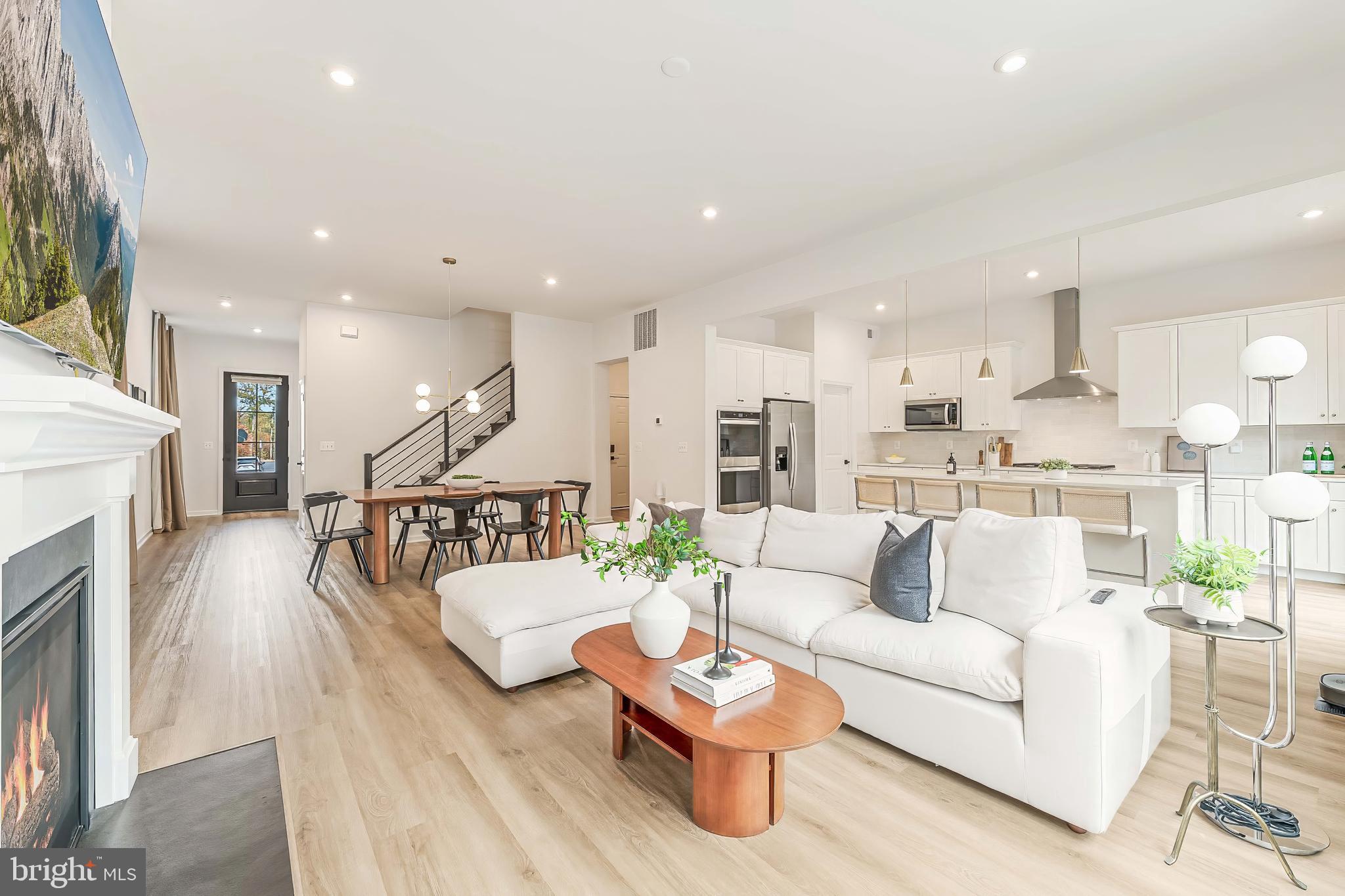18260 Moss Garden Road Dumfries, VA 22026 - Photo 10 of 97 a living room with furniture and a wooden floor
