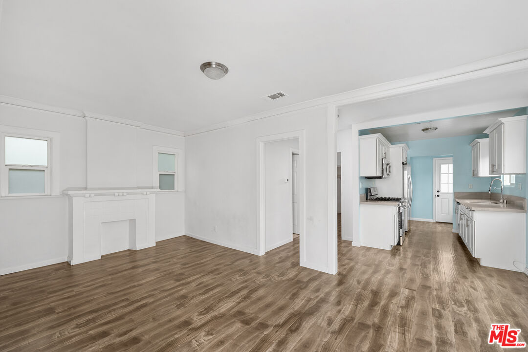 2738 Cloverdale Avenue Los Angeles, CA 90016 - Photo 5 of 17 a view of empty room with wooden floor