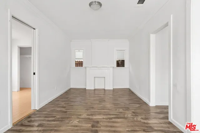 a view of a kitchen with wooden floor