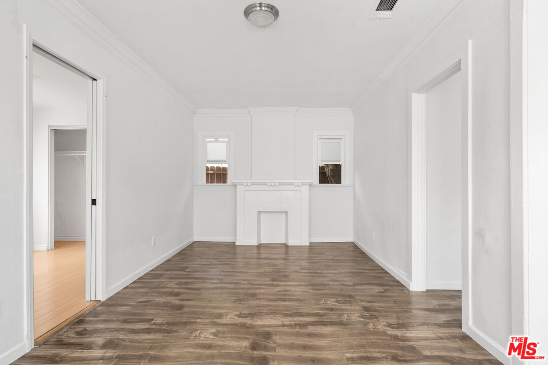 2738 Cloverdale Avenue Los Angeles, CA 90016 - Photo 7 of 17 a view of a kitchen with wooden floor