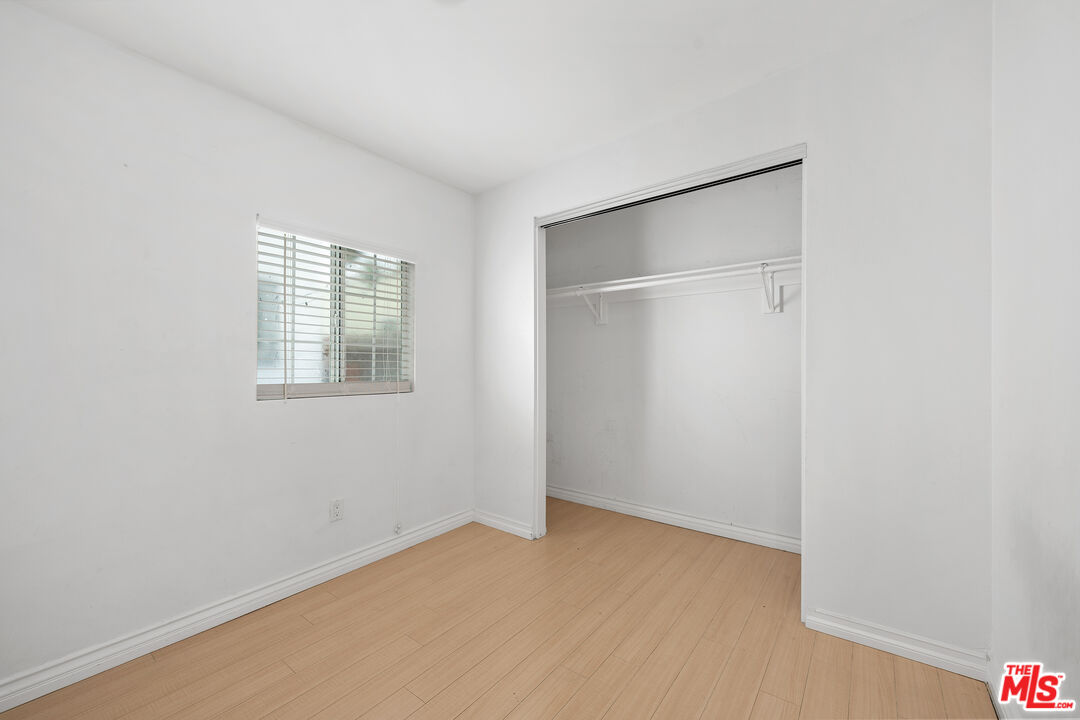 2738 Cloverdale Avenue Los Angeles, CA 90016 - Photo 8 of 17 a view of an empty room with a window
