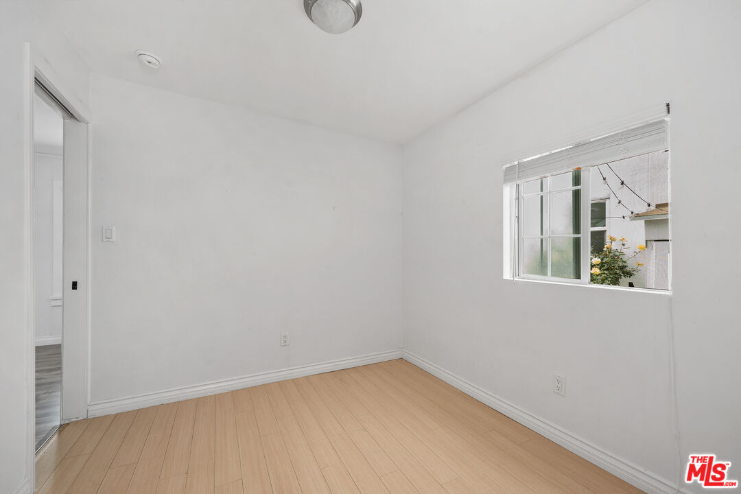 2738 Cloverdale Avenue Los Angeles, CA 90016 - Photo 9 of 17 a view of an empty room with a window