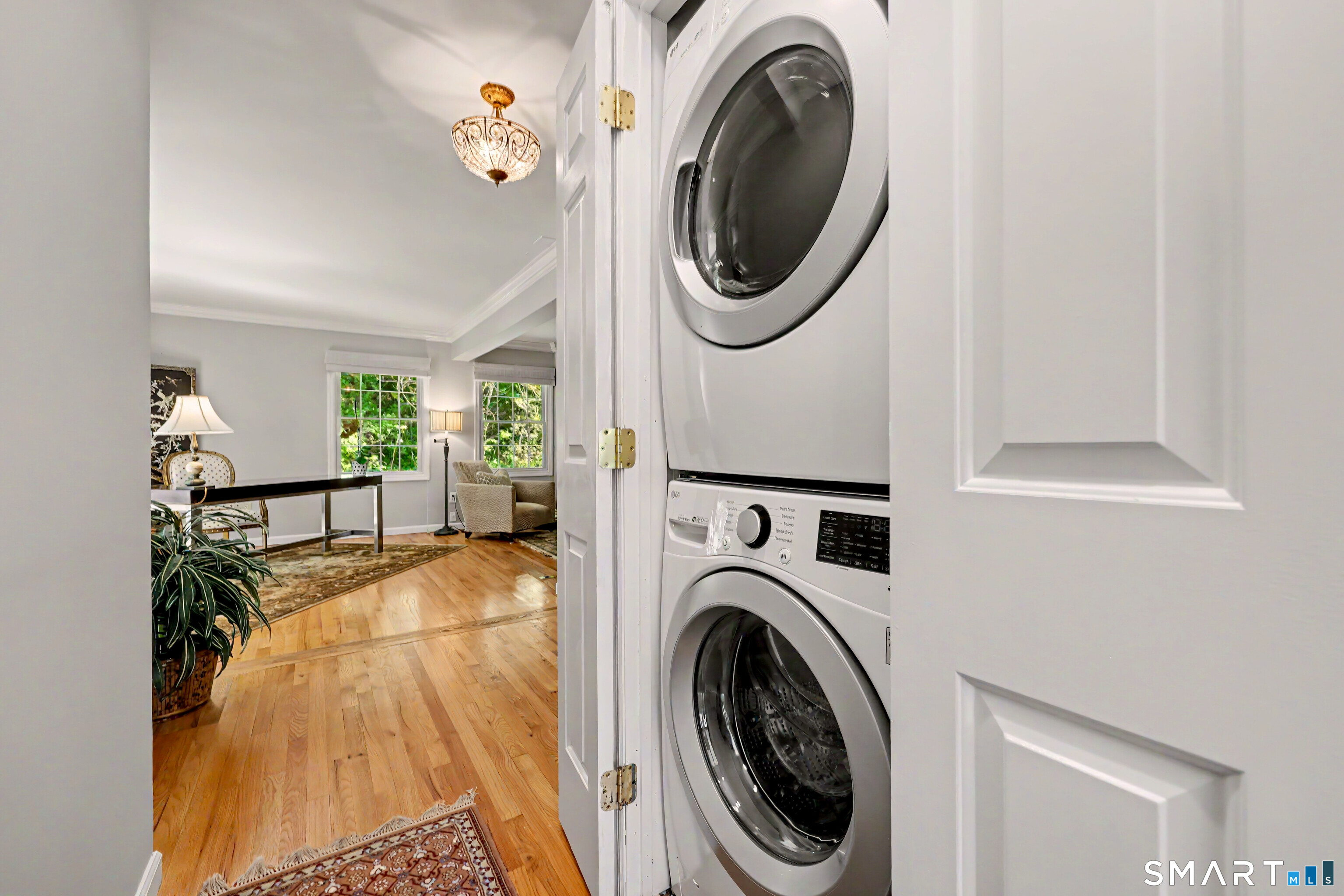 120 Prospect Street, Unit 46 Ridgefield, CT 06877 - Photo 17 of 36 a view of a hallway with washer and dryer