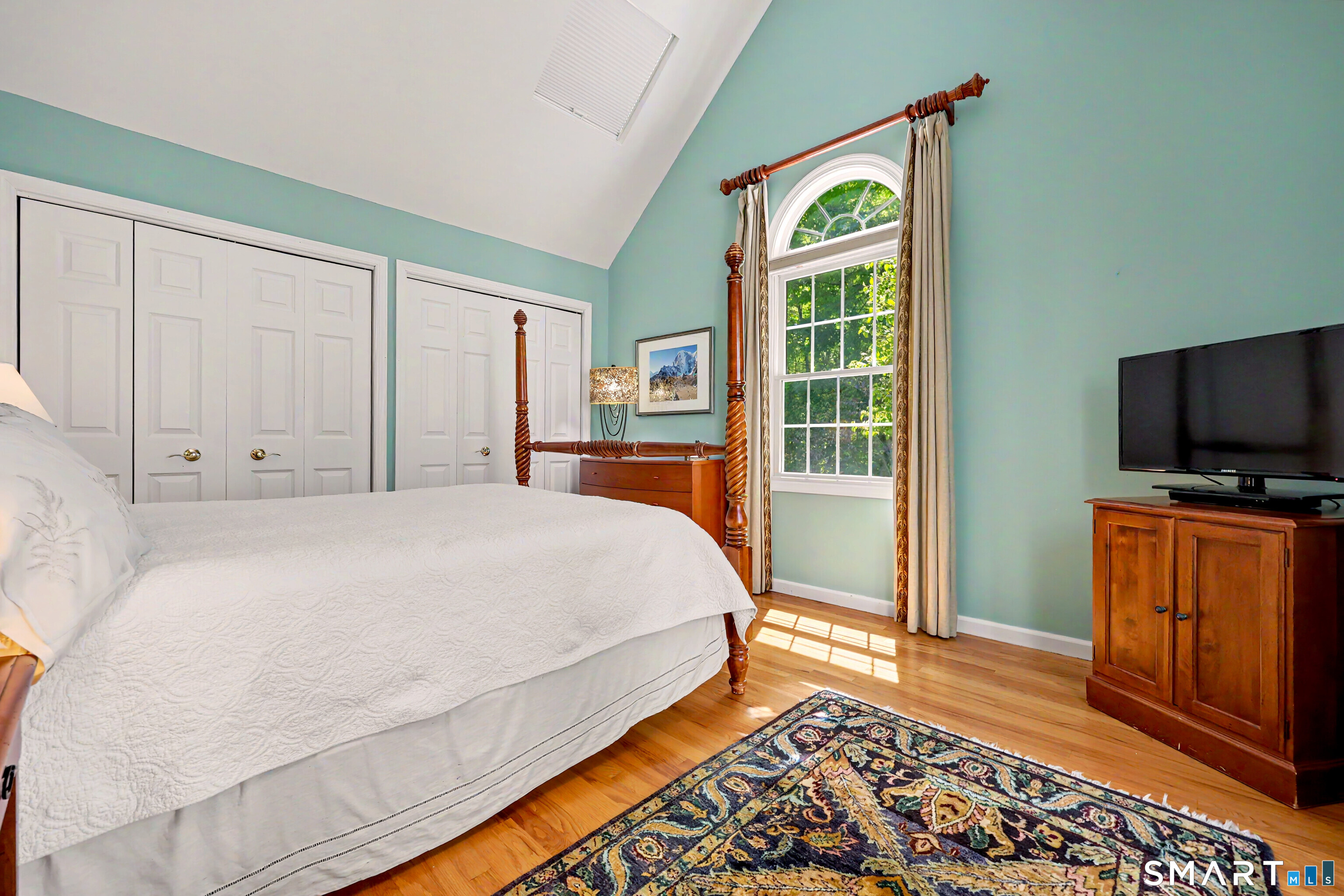 120 Prospect Street, Unit 46 Ridgefield, CT 06877 - Photo 18 of 36 a bedroom with a bed and a flat screen tv