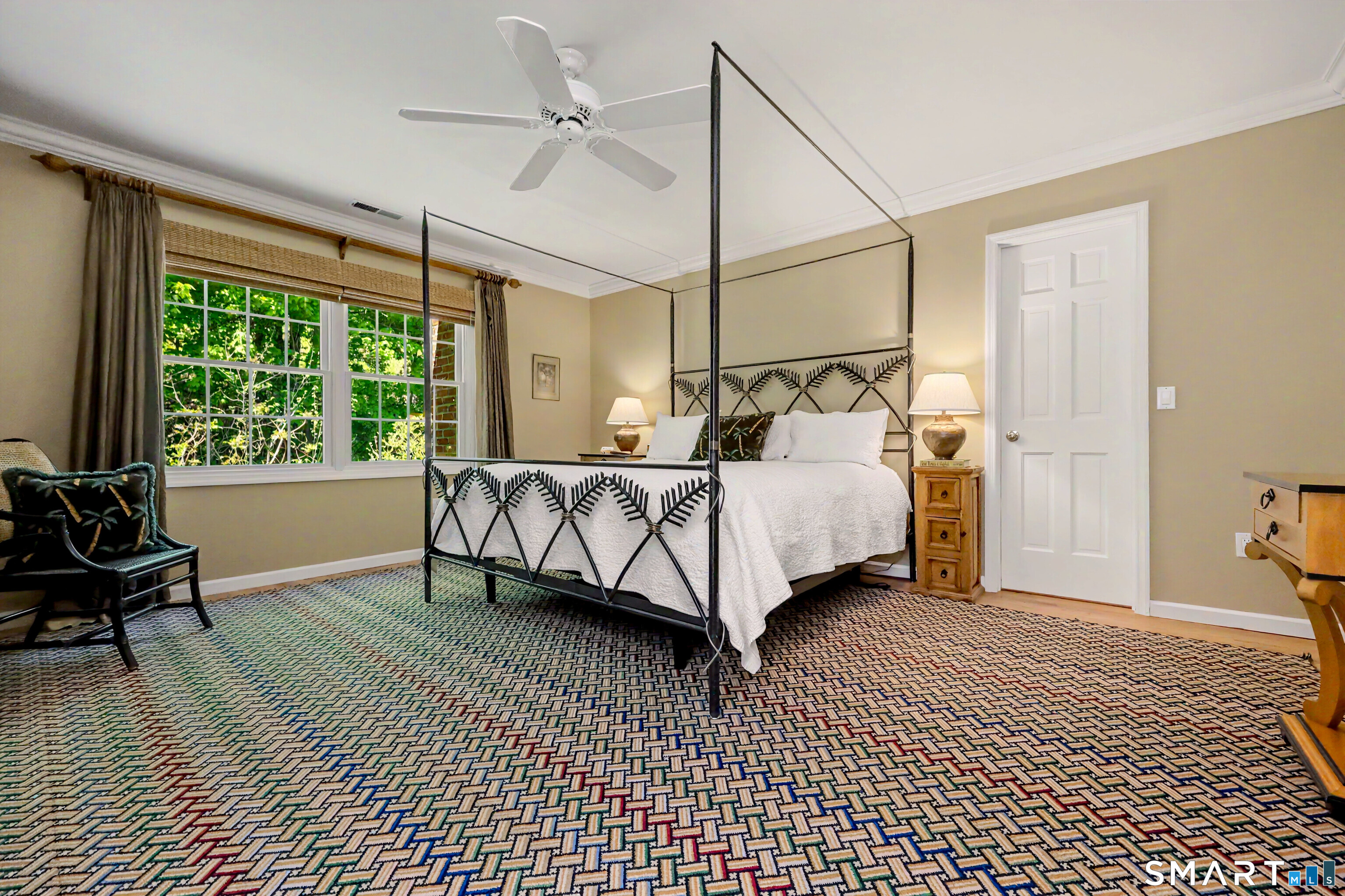 120 Prospect Street, Unit 46 Ridgefield, CT 06877 - Photo 26 of 36 a bedroom with a bed lamp and a large window