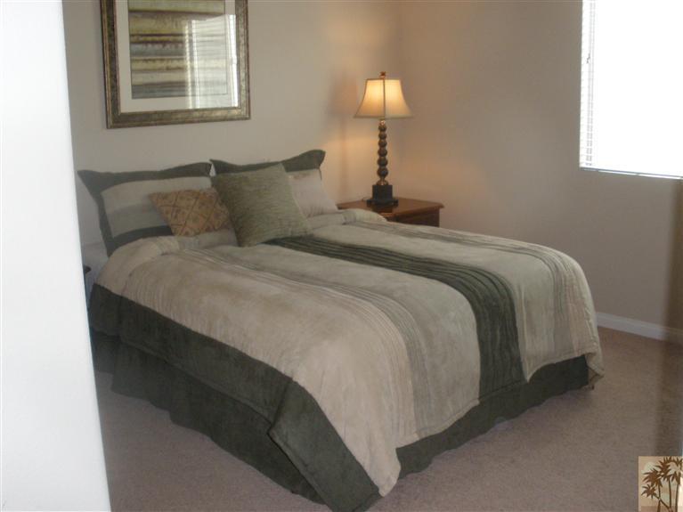 81673 Avenida Alturas Indio, CA 92203 - Photo 12 of 17 a bedroom with a bed and a lamp