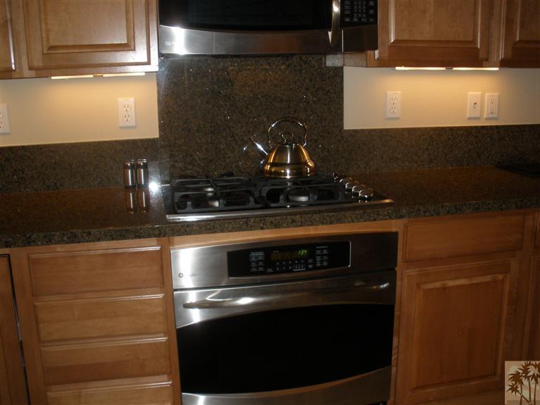 81673 Avenida Alturas Indio, CA 92203 - Photo 15 of 17 a stove top oven sitting inside of a kitchen