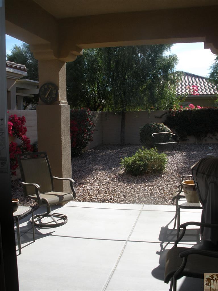 81673 Avenida Alturas Indio, CA 92203 - Photo 2 of 17 a view of a patio with table and chairs and potted plants