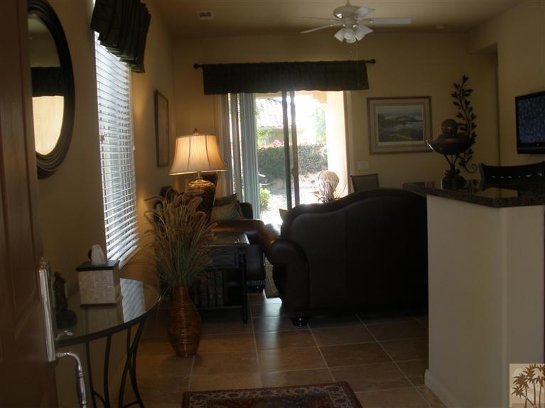 81673 Avenida Alturas Indio, CA 92203 - Photo 7 of 17 a living room with furniture and a fireplace
