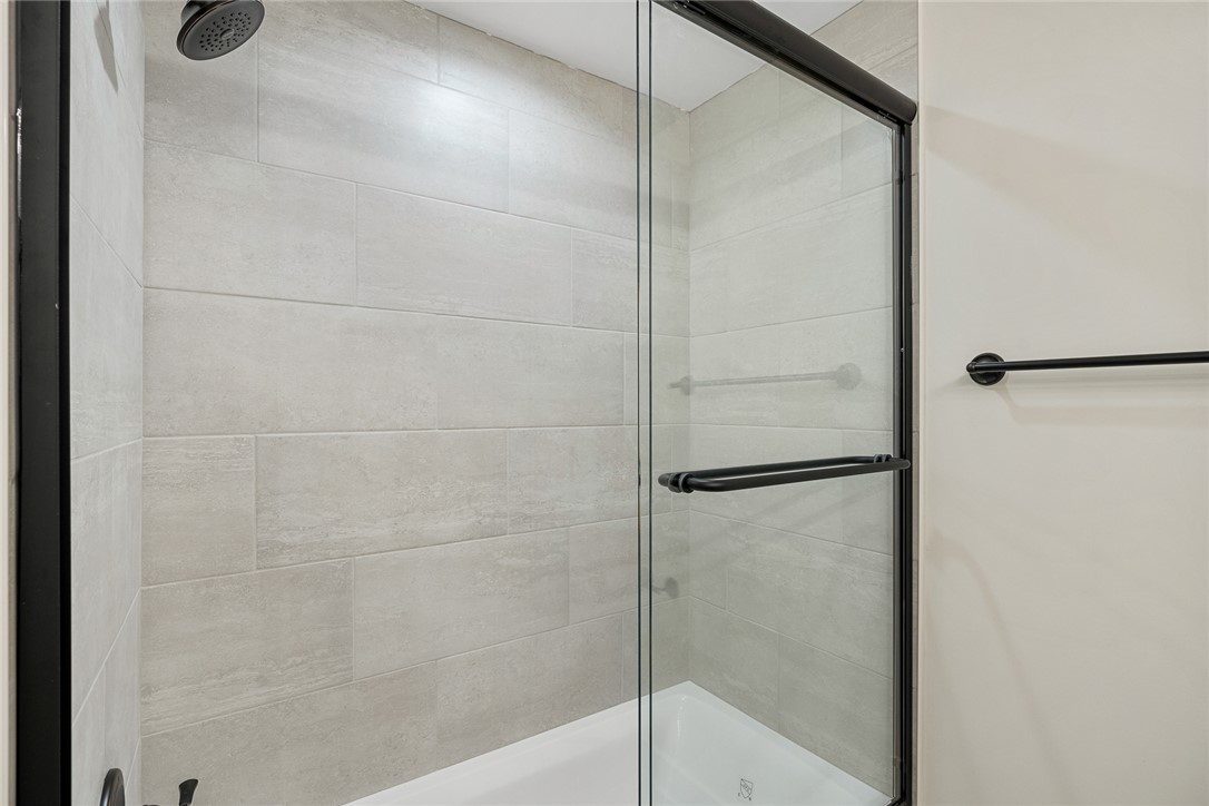 100 Garden Gate Drive Anderson, SC 29621 - Photo 29 of 43 This modern bath features a spacious shower with sleek tile walls.