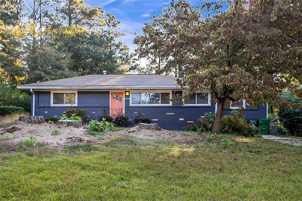 2064 Rosewood Road Decatur, GA 30032 - Photo 1 of 1 a front view of a house with garden