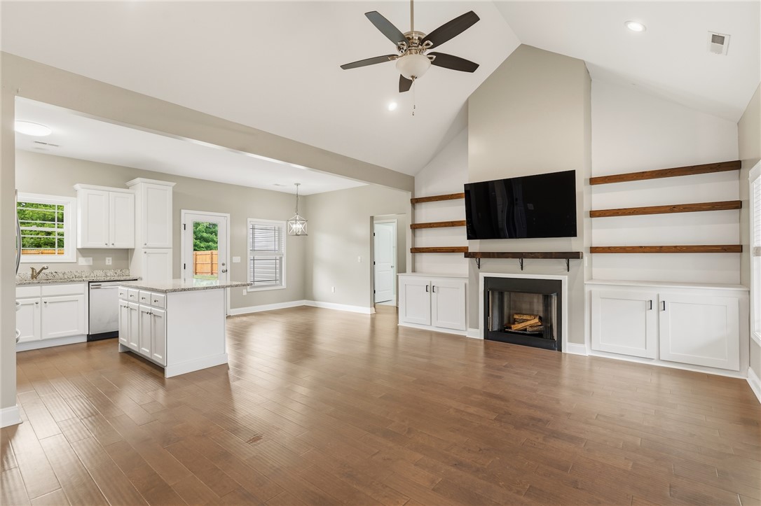 1411 Dunn Road Anderson, SC 29625 - Photo 4 of 30 This expansive great room seamlessly connects the kitchen and living areas, offering a fluid and inviting space.