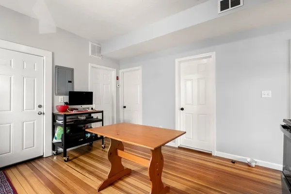 a view of a livingroom with furniture and wooden floor
