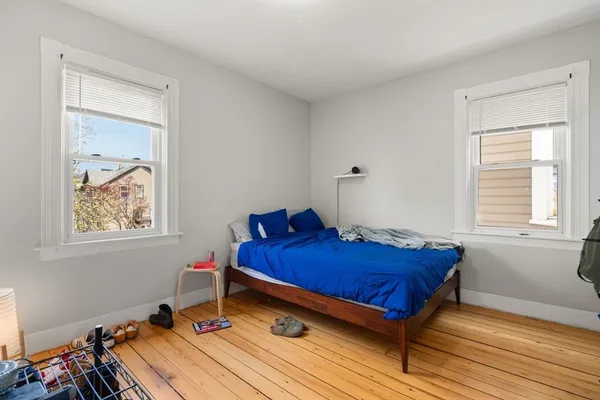 a bed room with a bed and a window