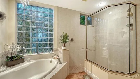 a bedroom with a bed and the view of bathroom