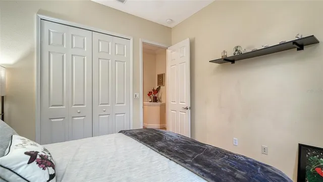 a balcony with furniture and a potted plant
