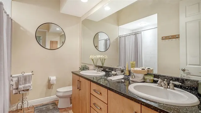 a view of balcony with two chairs and a table