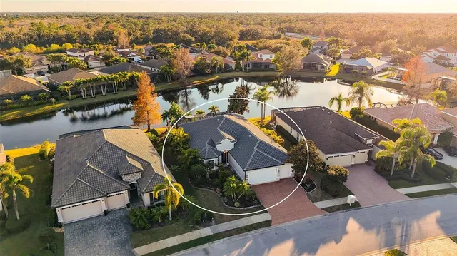 a kitchen with stainless steel appliances granite countertop a kitchen island a stove and a refrigerator