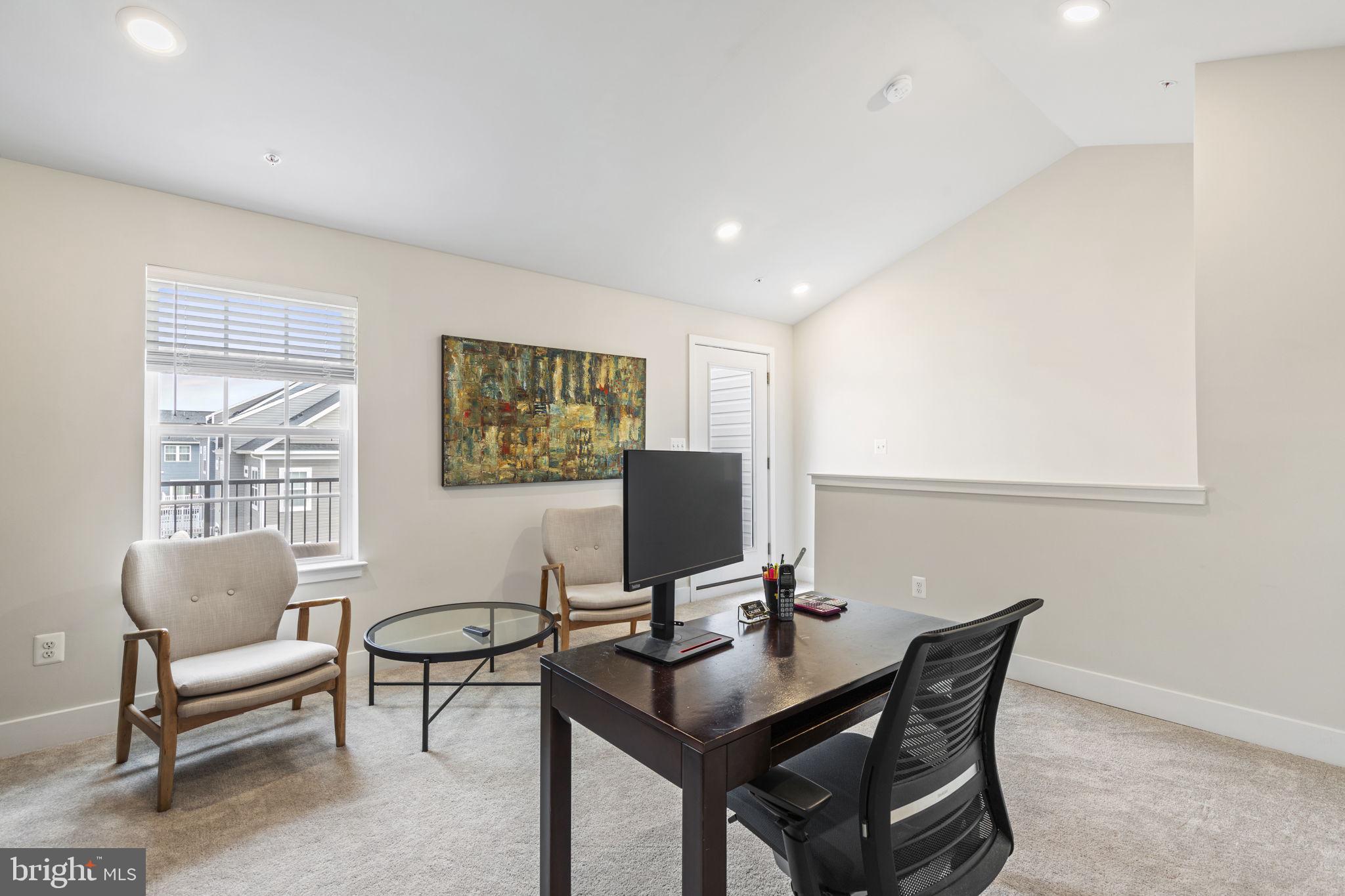 2045 Ivory Brook Road Baltimore, MD 21244 - Photo 29 of 39 a view of a workspace with furniture and a window