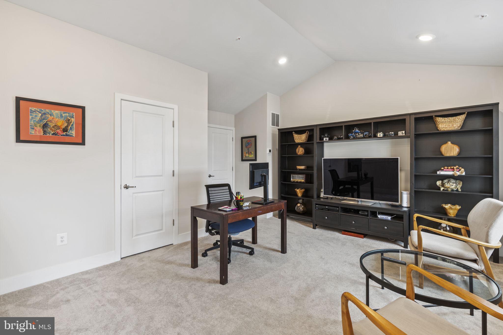2045 Ivory Brook Road Baltimore, MD 21244 - Photo 30 of 39 a living room with furniture and a flat screen tv