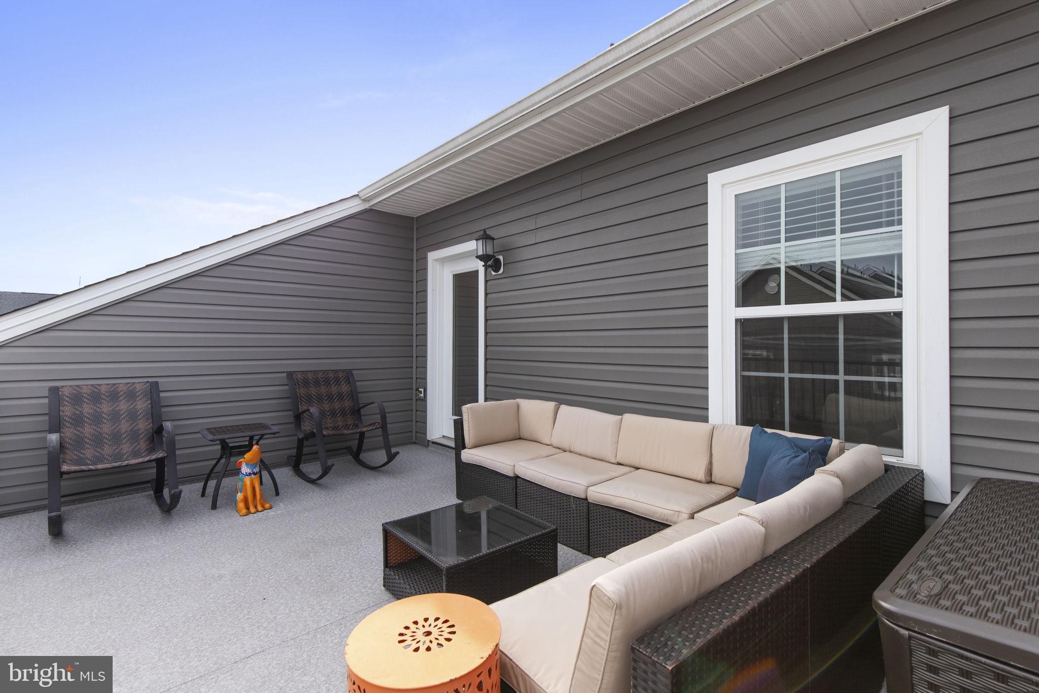 2045 Ivory Brook Road Baltimore, MD 21244 - Photo 31 of 39 a view of a patio with couches and potted plants with sky view