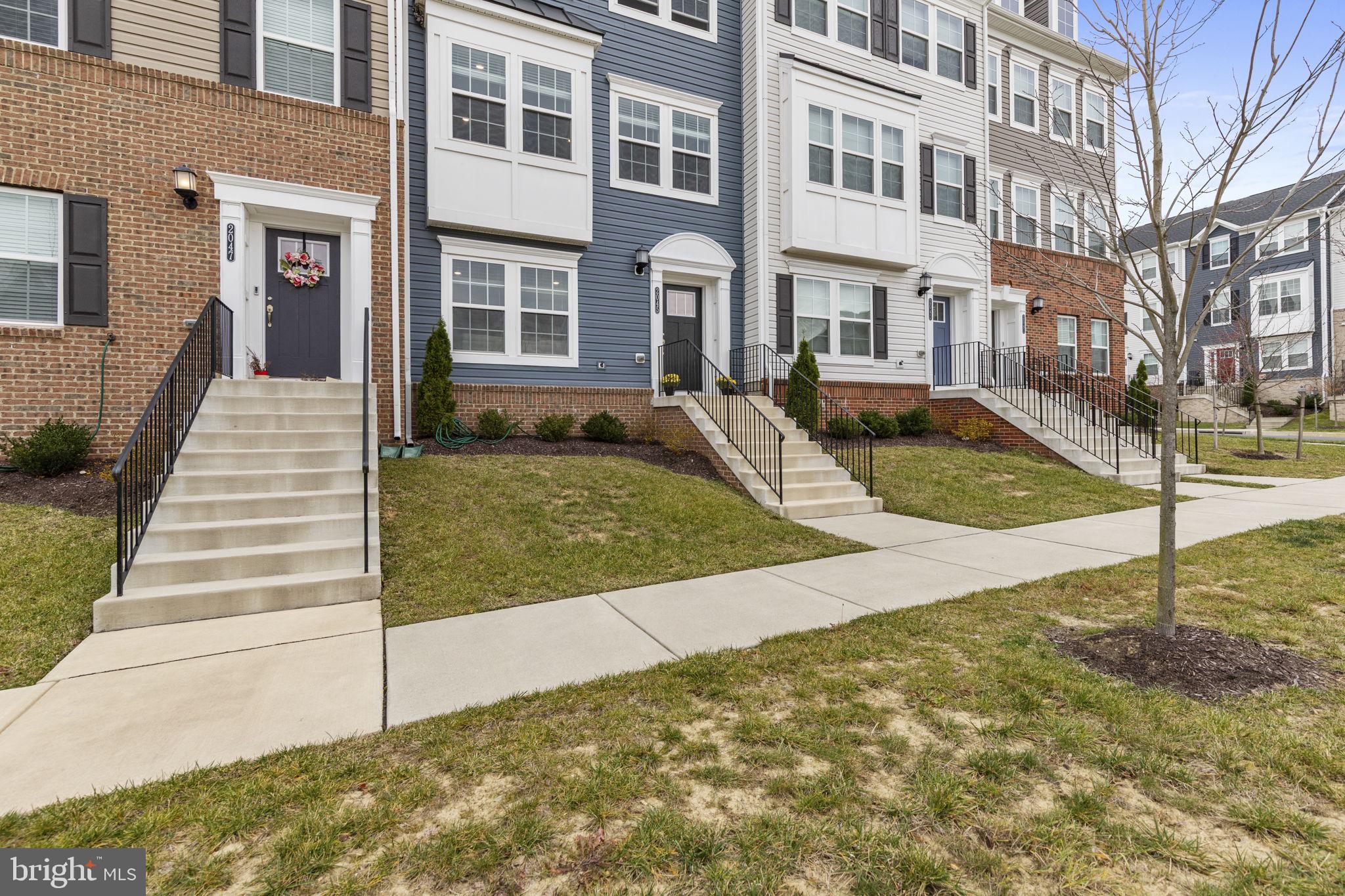 2045 Ivory Brook Road Baltimore, MD 21244 - Photo 39 of 39 a view of a brick building next to a yard