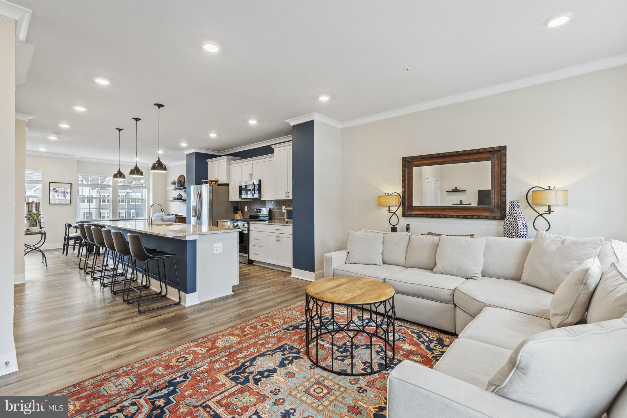 2045 Ivory Brook Road Baltimore, MD 21244 - Photo 9 of 39 a living room with furniture and a view of kitchen