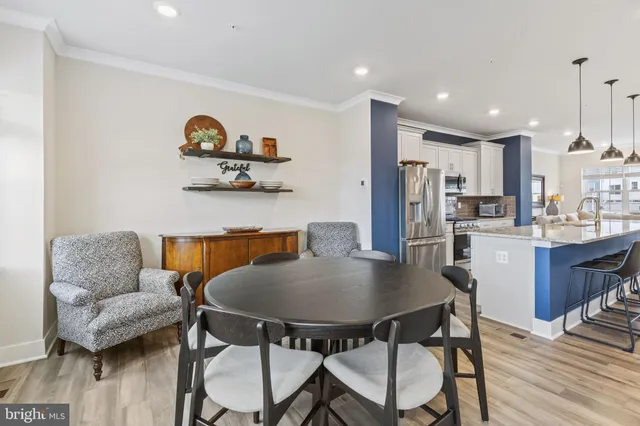 a view of kitchen with furniture and wooden floor