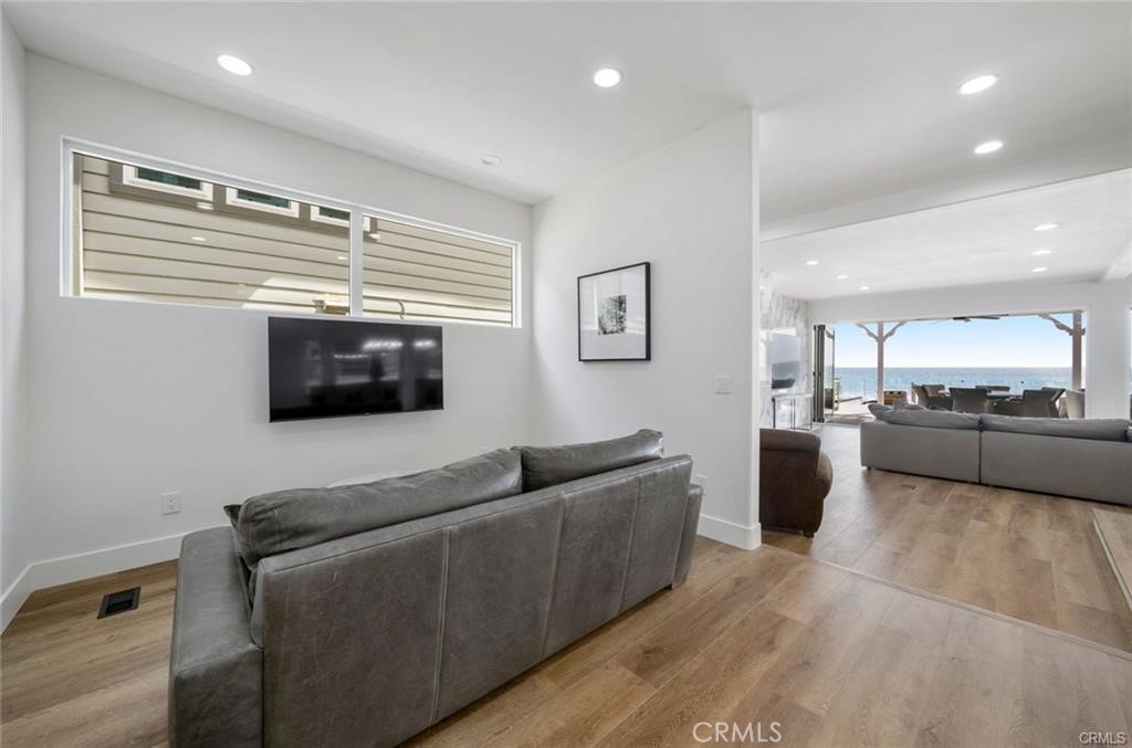35555 Beach Road Dana Point, CA 92624 - Photo 16 of 68 a living room with furniture and a flat screen tv