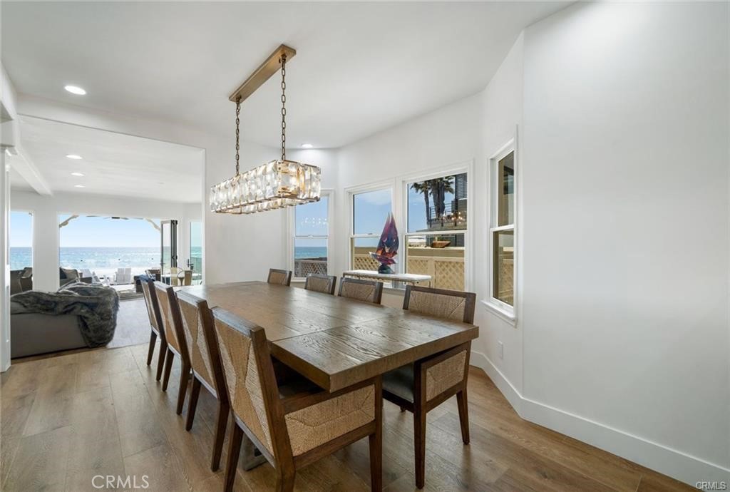 35555 Beach Road Dana Point, CA 92624 - Photo 17 of 68 a view of a dining room with furniture and wooden floor