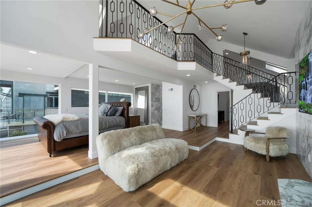 35555 Beach Road Dana Point, CA 92624 - Photo 33 of 68 a living room with furniture and a chandelier