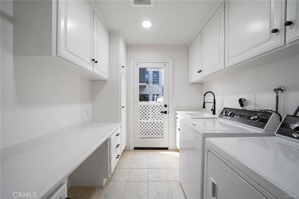 35555 Beach Road Dana Point, CA 92624 - Photo 50 of 68 a kitchen with white cabinets and sink